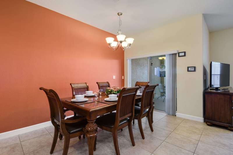 Located next to the kitchen,  this dining area offers plenty of space for the family to get together and enjoy a meal.